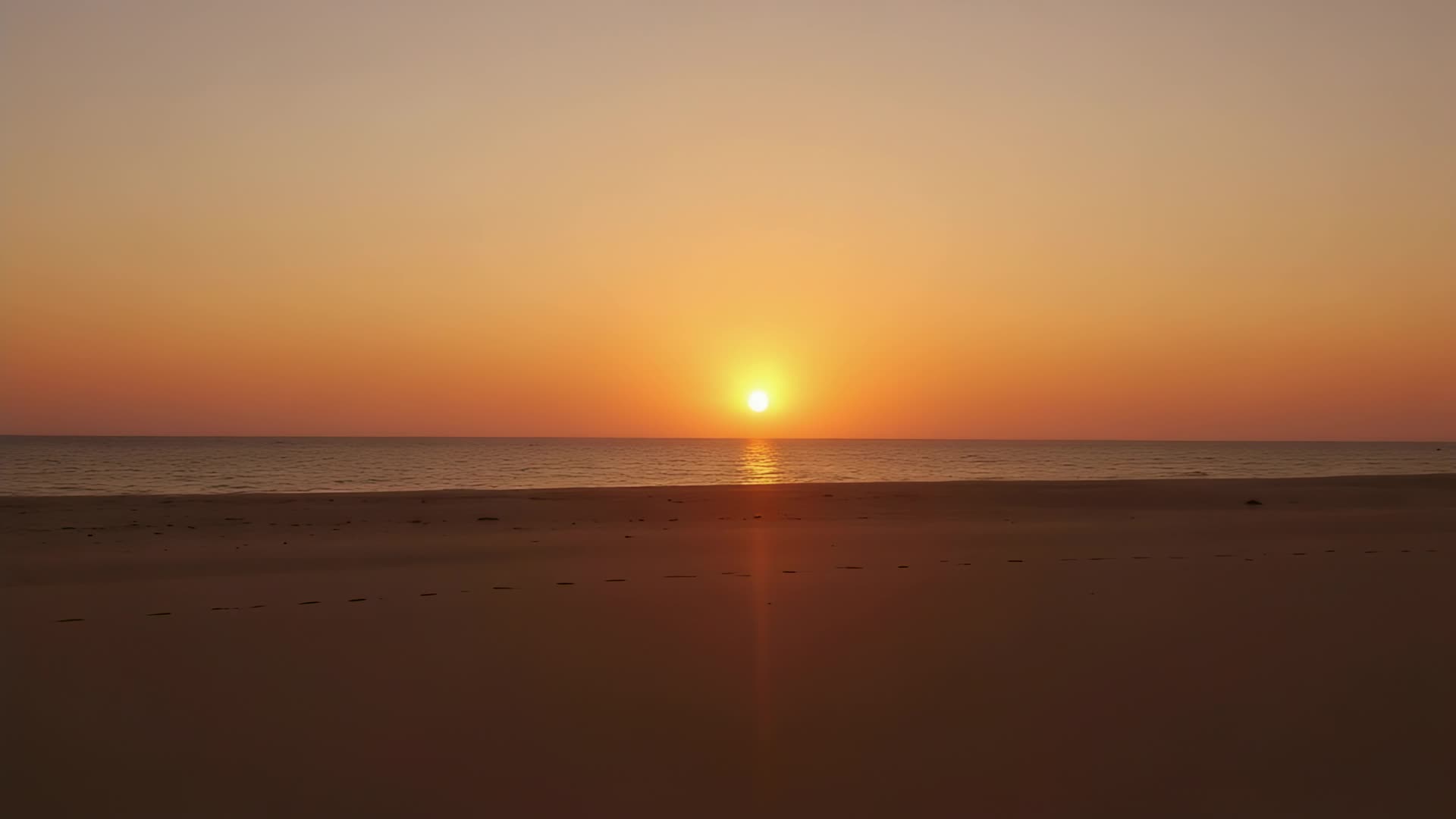 Empty beach, slow pan (sunset)