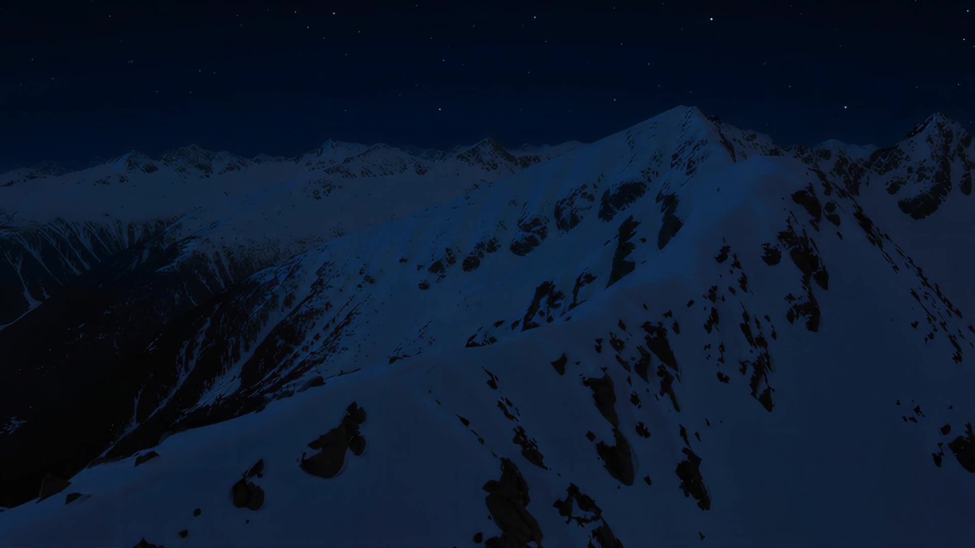 Aerial over snow-capped ridge, night version
