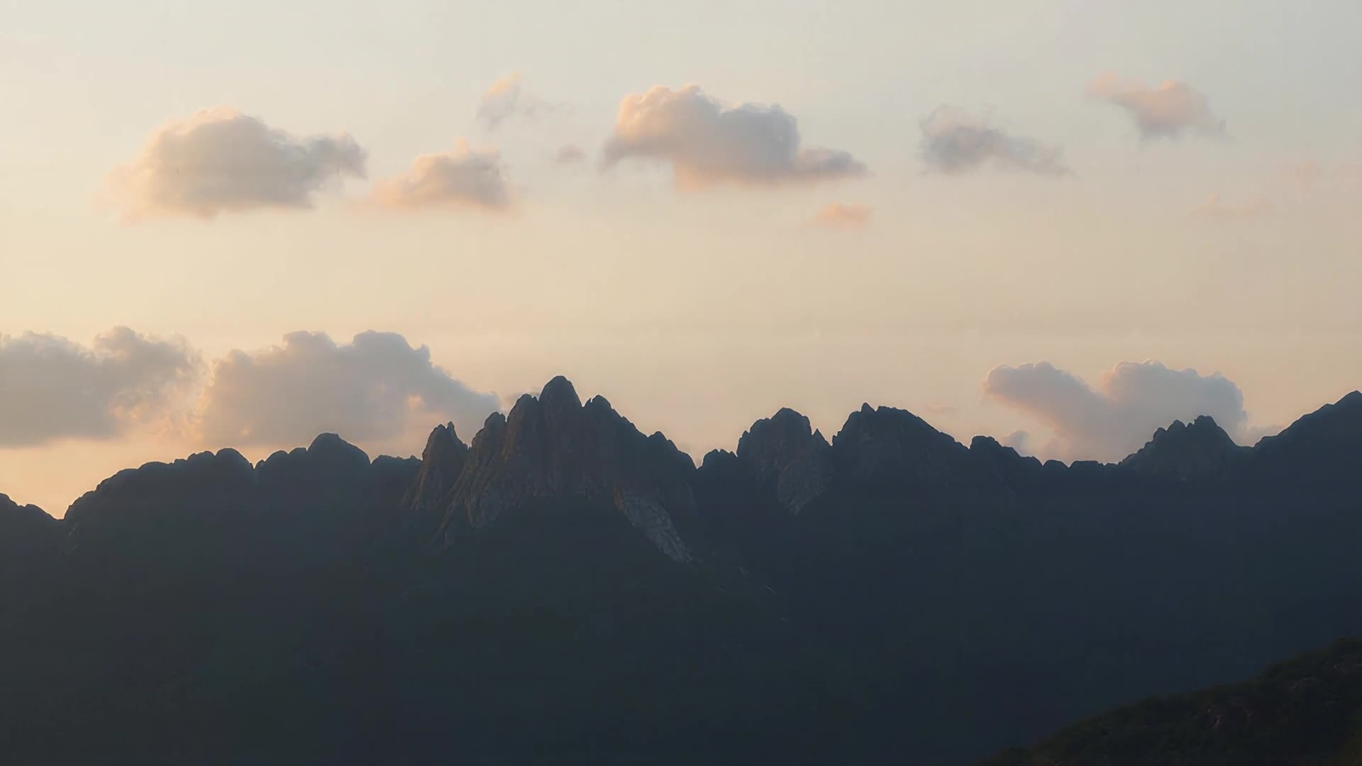 Jagged ridgeline in silhouette, day version