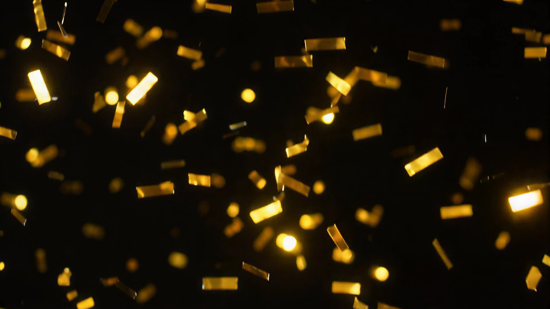 Gold foil confetti falling