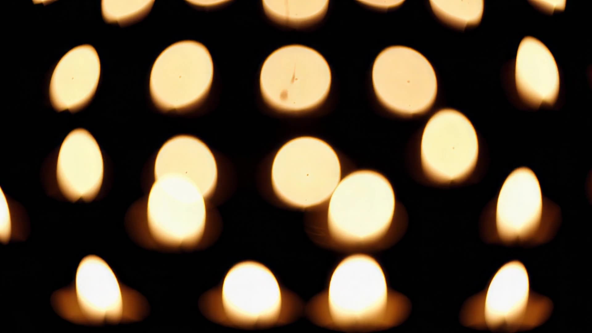 Diya lights out of focus, drifting