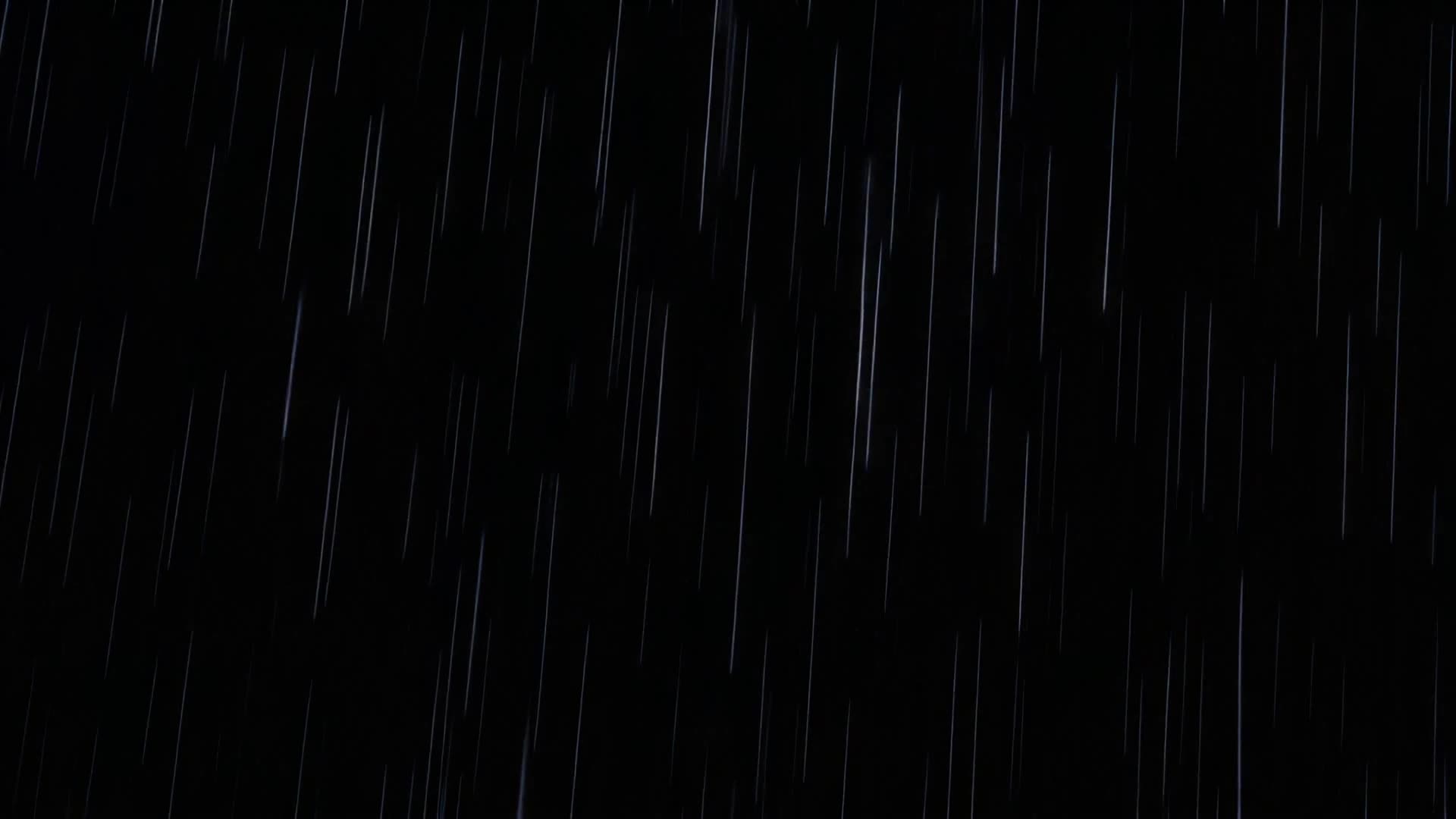 Backlit rain streaks on black