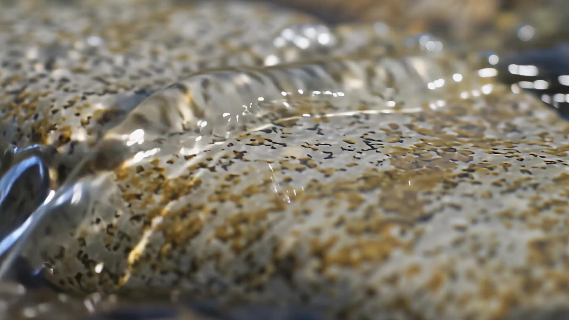 Water running over smooth stone